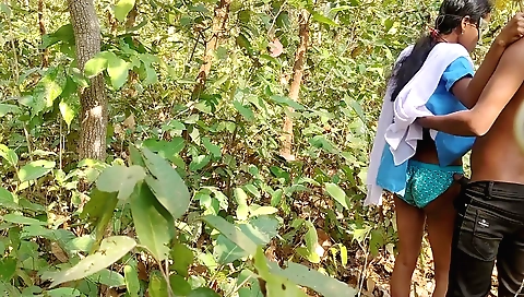 Busty brunette girl with a nice body is on the jungle road
