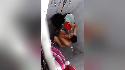 Indian busty brunette gets nude in the camera bath
