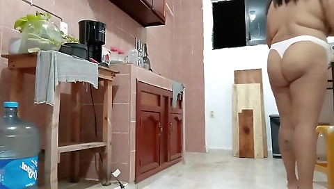 Sexy amateur solo female in the kitchen wears a white thong