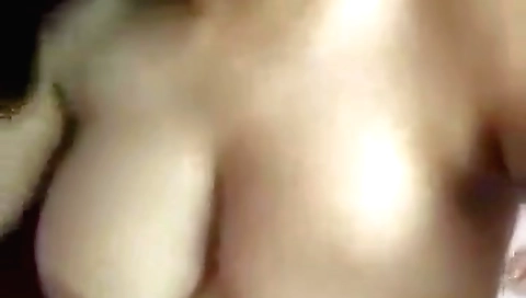 Busty brunette with small and big tits in amateur video
