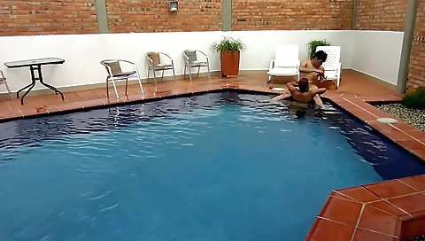 Indian girl in red swimsuit and shorts has a great time