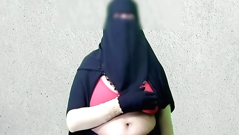 Indian woman in a dress enjoys her big titties and her ass