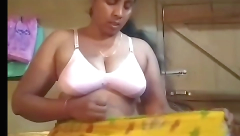 Busty brunette amateur shows off her big boobs and tits