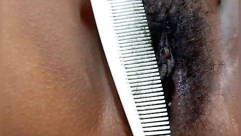 Indian girl with hairy pussy is playing with a toy