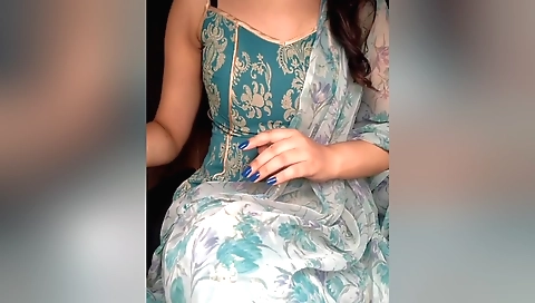 Sexy brunette is getting naked on webcam in sexy clothes
