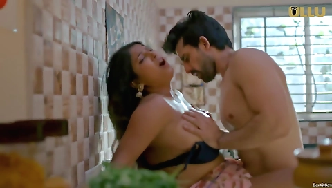 A hot brunette is getting fucked by two men in a threesome