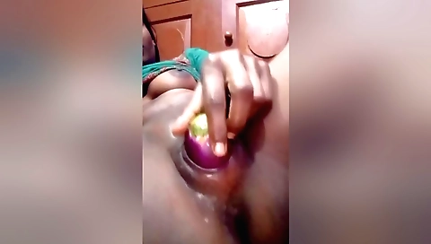 Indian girl masturbates with her dildo in her bedroom