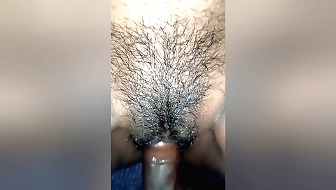 Hairy chick with long natural tits humps her pussy