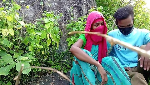 Girl in green outfit rides her boyfriend in the park