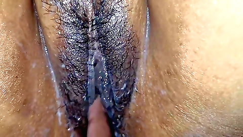 Indian wife enjoys fingering and rubbing hairy pussy