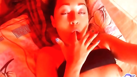 Romantic brunette babe with a big bubble under her tits